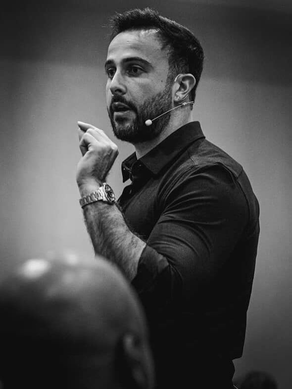 Marczell Klein on stage, black-and-white portrait