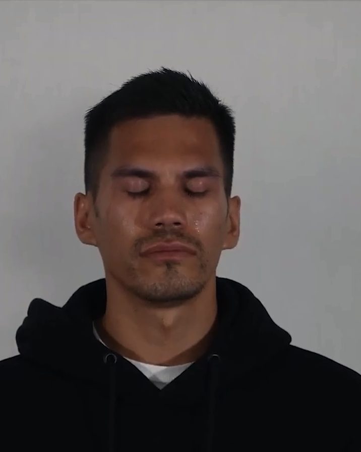 An attendee with his eyes closed during a guided session.