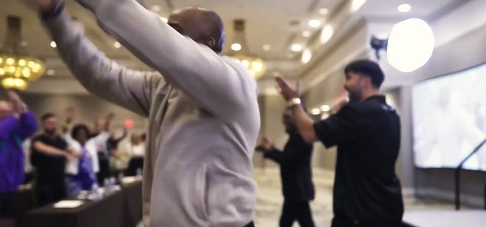 An attendee shouting with joy during a live event.